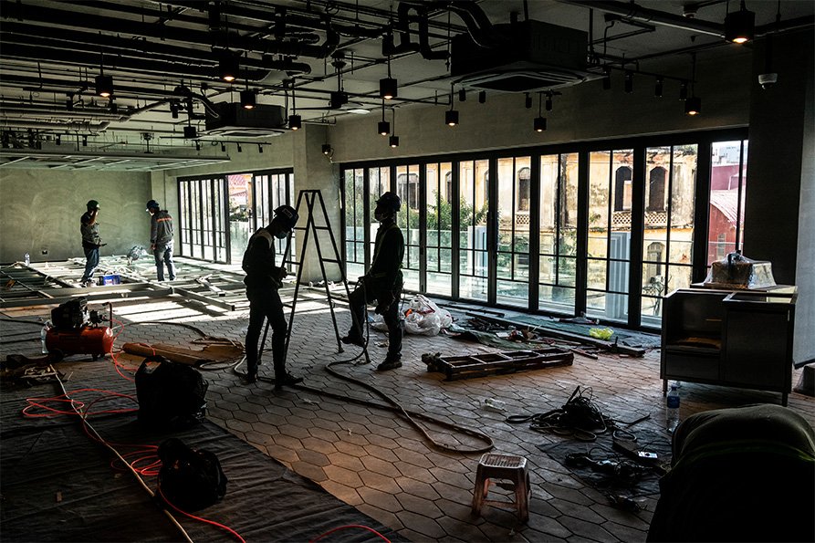 Argcjho Construction workers ripping out old space for renovation