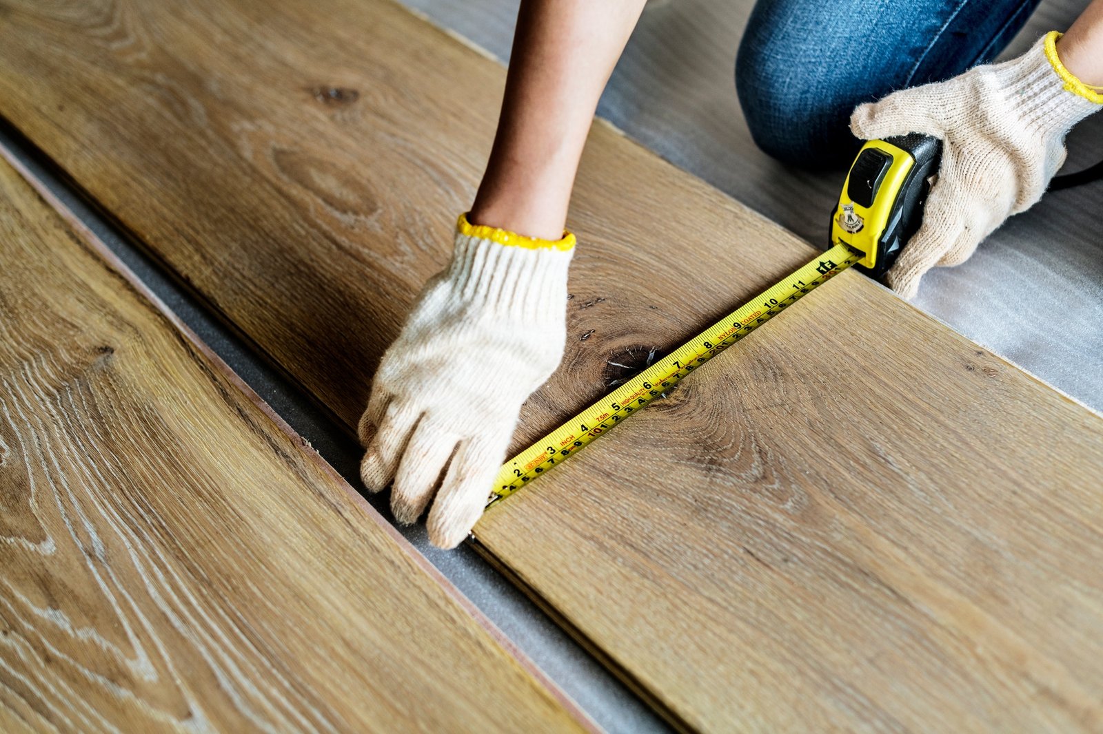 Carpenter man installing wooden floor