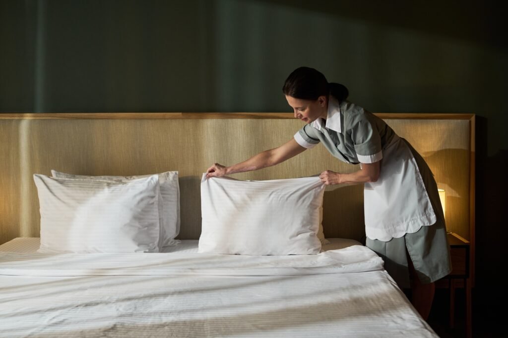 Making Bed in a Clean Modern Hotel Room