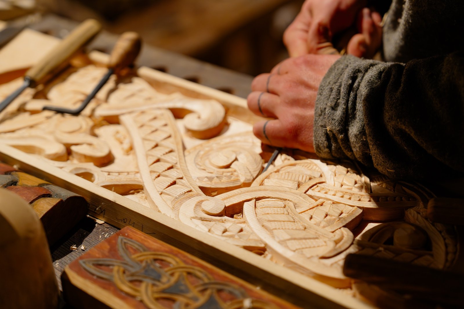 Woodworking Artistry: Masterful Carpenter Crafting Detailed Designs on Wood